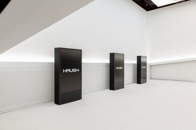 A modern booth with video screens by Krush at CES 2016